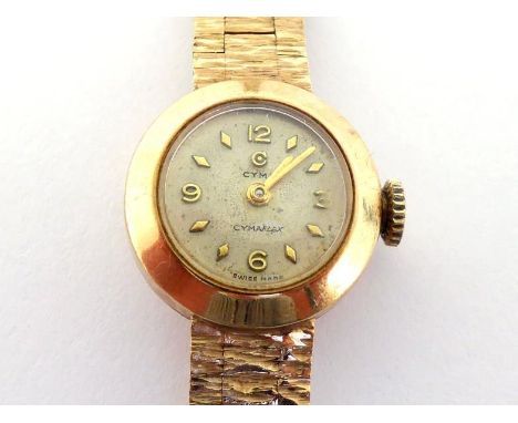 CYMA, a lady's 9 carat gold manual wind wristwatch, the silvered dial with gilt detail, the case 17mm wide, on an integral ba