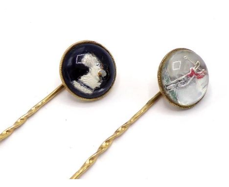 Two reverse crystal intaglio stickpins, the circular intaglios depicting the head of a wolfhound and a golfer, 13mm diameter,