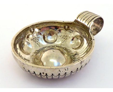 A French Provincial silver wine taster, 1st. standard, 1819/38, with ribbed ring handle, sides fluted on one half and lobed a