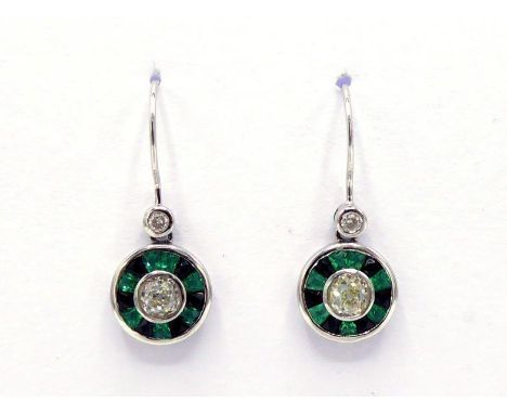 A pair of emerald, onyx and diamond earrings, the circular drops with an old mine cut to the centre, in a surround of alterna