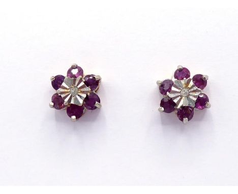 A pair of 9 carat gold, ruby and diamond cluster ear studs, each flower cluster 9mm diameter, post hallmarked, butterfly fitt
