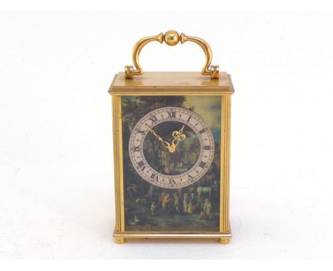 A modern gilt brass carriage style clock with Swiss eight day key wind  movement, the silvered chapter ring with Roman numera