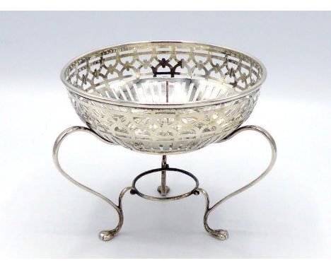 A silver sweet dish by Abrahams Brothers, Birmingham, 1914, sides pierced with band of slats below fretwork band, on three sc