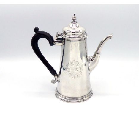 A George II silver coffee pot by David Willaume (II), London, 1731, tapering sides engraved with contemporary baroque coat of