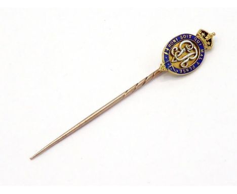 An early 20th century gold and enamel stick pin, the enamelled head depicting the Order of the Garter centred with the Royal 