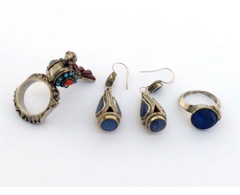 A mixed lot of Indian white metal jewellery, including a pair of lapis-set earrings, a lapis ring, and a turquoise, coral and
