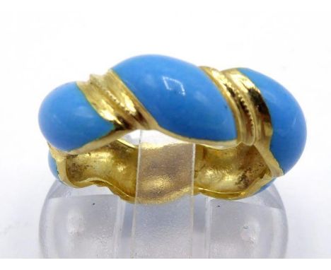 A yellow metal (tests 18 carat gold) and blue enamel band ring, spiral design, finger size M, 5.1gms CONDITION: repair to ena