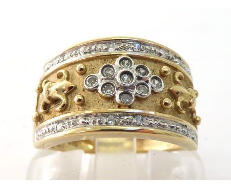 A 9 carat gold and diamond band ring, with a central ornamental band set with a cluster of single cuts, an illusion set singl