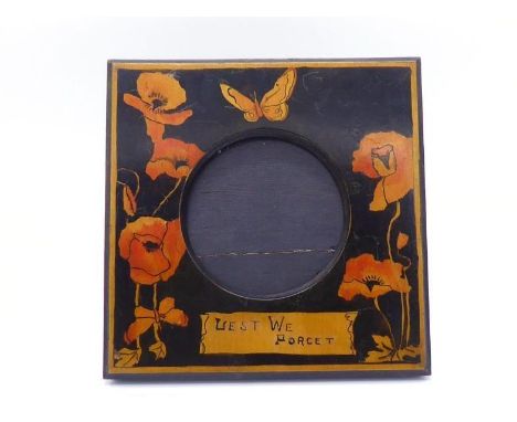 A circular birchwood photo frame in square surround with simple strut back, hand made with stained red poppies  and butterfli