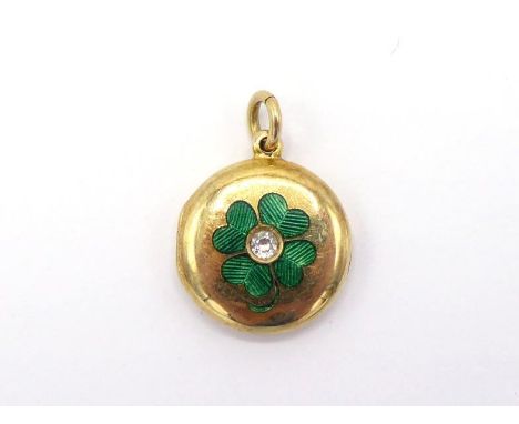 A diamond and enamel locket, the circular locket with a green guilloche enamel clover, an old cut diamond to the centre, the 