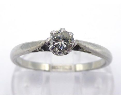 A diamond single stone ring, the central brilliant cut approx. 0.10 carat, the shank stamped ‘18CTPLAT’, finger size N/O, 2.1