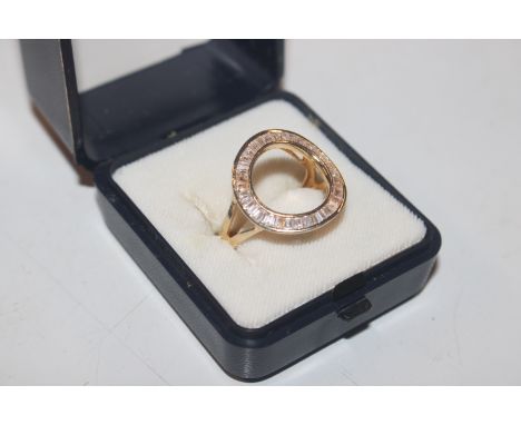 A Elanza Sterling silver gilt and Cubic Zirconia open face ring, size Q/R