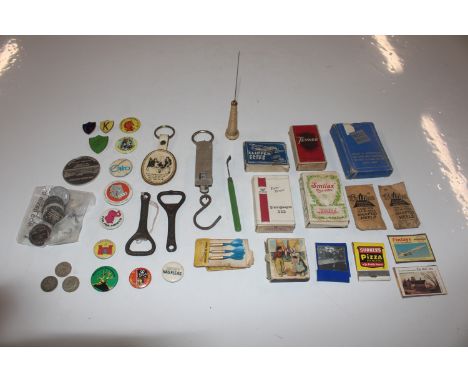 A box of miscellaneous items including scales, badges etc.