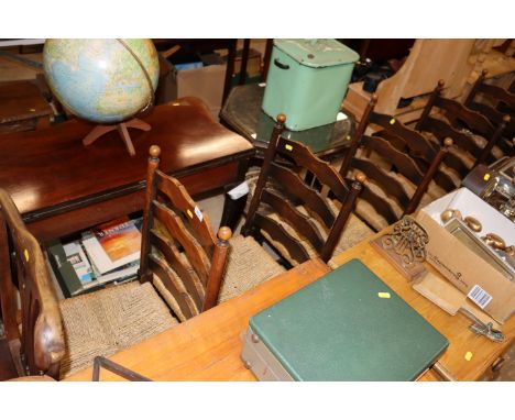 A set of six rush seated ladder back dining chairs 