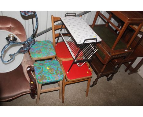 Three retro stools; a bentwood ladder back chair and a vintage magazine rack