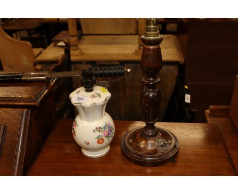 A Newport Pottery Burslem Clarice Cliff floral decorated table lamp and a turned oak table lamp