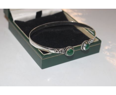 A 925 silver and jade set bangle 