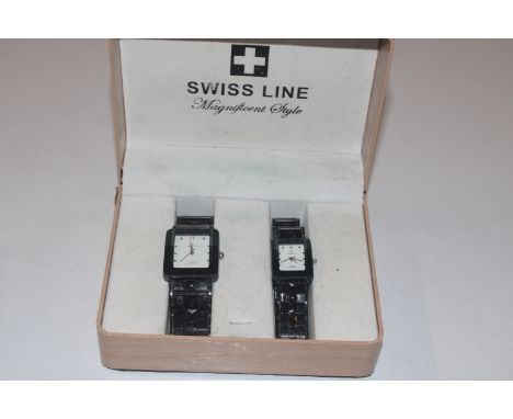 A pair of His and Hers boxed Swiss Line wrist watches; and a Casio Databank calculator wrist watch 