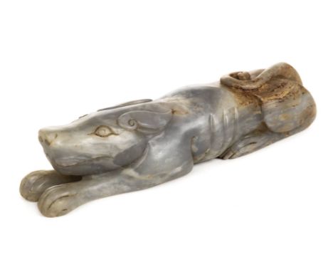 *Jade Carving. A Chinese carving of a recumbent dog,  carved in the archaic style, 14cm long  (1)