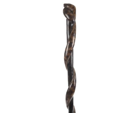 *Walking Cane. Carved wood walking stick,  the shaft carved with an entwined snake, 94cm long  (1)