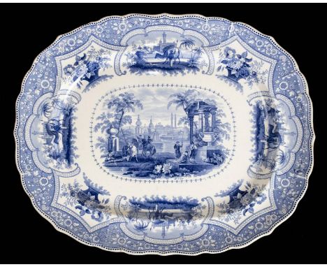 *Blue and White. Large Victorian pottery meat plate,  printed with classical figures, amongst a border of classical figures a