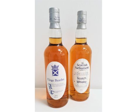 TWO BOTTLES OF SIGNED BLENDED SCOTCH WHISKY comprising one bottle of The Scottish Parliament Scotch Whisky possibly signed by