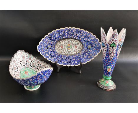 MIDDLE EASTERN ENAMEL ON COPPER VASE AND DISHESthe vase raised on a circular foot, 22cm high, the boat shape dish 21.5cm long