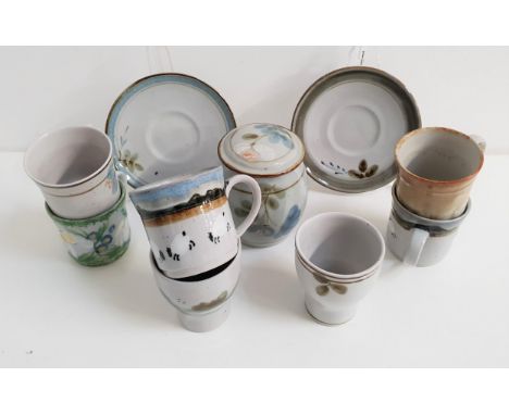 SELECTION OF HIGHLAND STONEWAREincluding six beakers, five mugs, four saucers and a lidded sugar jar (17) 