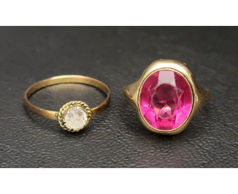 TEN CARAT GOLD DRESS RINGset with faceted ruby coloured glass, ring size I-J and approximately 2.6 grams; together with anoth