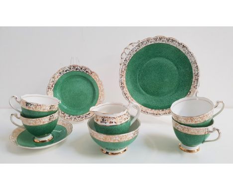 ROSLYN CHINA TEA SETdecorated with a mottled green ground with a gilt border, comprising eleven cups, ten saucers, twelve sid