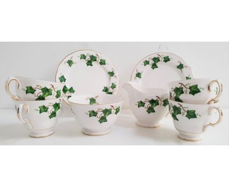 COLCLOUGH TEA SETdecorated with an ivy leaf border with gilt highlights, comprising eight cups and saucers, eight side plates