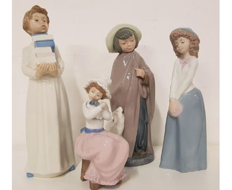 FOUR NAO FIGURINESincluding a child holding books, 28.5cm high, girl in a long skirt and hat, 24cm high, girl wrapped in a ca