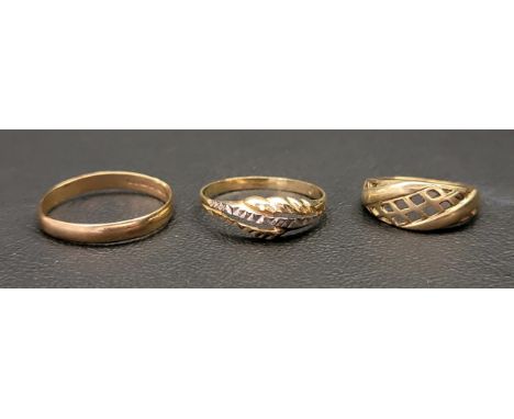 THREE GOLD RINGScomprising a two-tone engraved fourteen carat gold ring, approximately 1.5 grams and ring size R-S; and two n