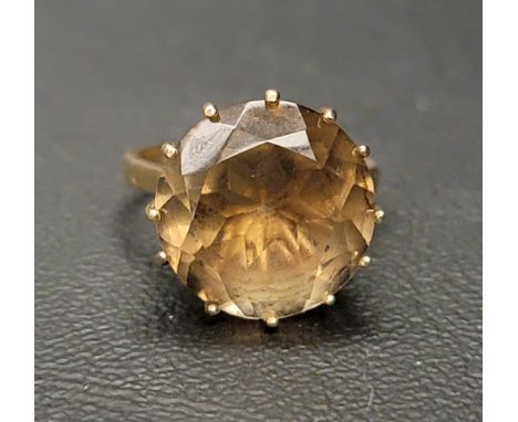 SMOKY QUARTZ SINGLE STONE RINGthe round cut gemstone measuring approximately 13.9mm x 13.9mm x 8mm, on nine carat gold shank,