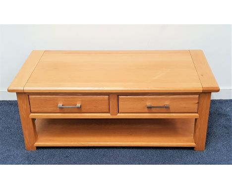 LIGHT OAK OCCASIONAL TABLEwith a rectangular top above two frieze drawers with a shelf below, standing on plain supports, 120