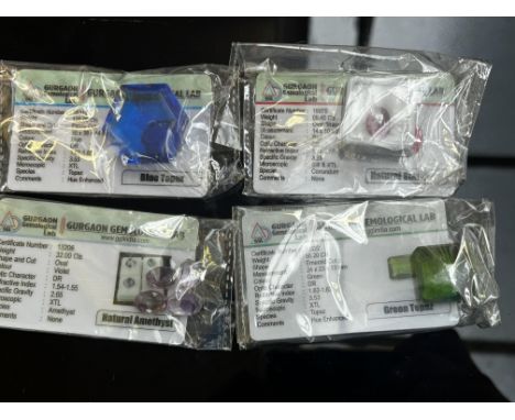 120ct Blue topaz, 9.45ct natural star ruby, 32ct natural amethyst & 56.20ct green topaz - All with coa 