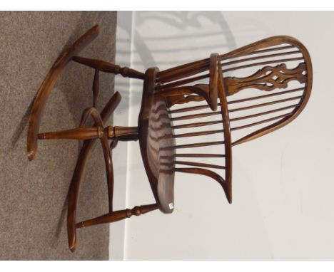 20th century elm and ash Windsor rocking armchair, double hoop, stick and pierced splat back, turned supports connected by cr