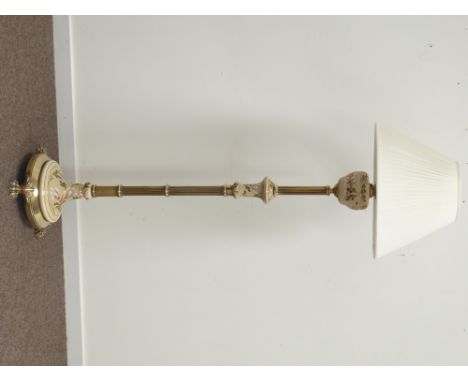 Late 20th century brass column and ceramic standard lamp, textured and floral painted, circular base with paw feet,  H183cm
