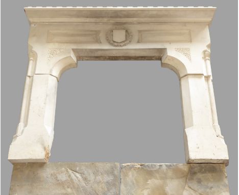 Gothic revival limestone fire surround with hearth - crenel carved and torus moulded mantel piece sat on stepped arched apron