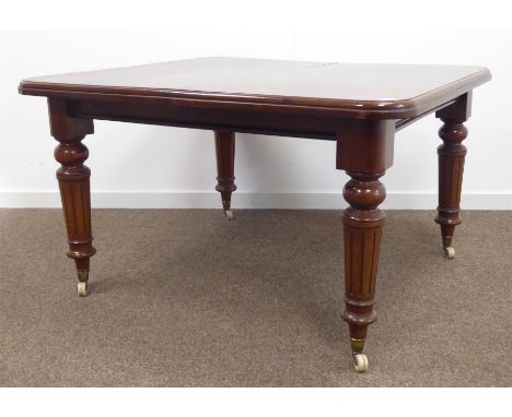 Victorian mahogany dining table, rectangular moulded top with rounded corners, turned fluted supports with ceramic castors, a