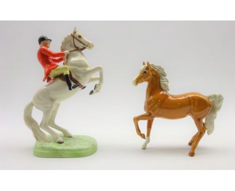 Beswick huntsman on rearing horse, painted white gloss No. 868 second version and a Beswick palomino  horse No.1261, first ve