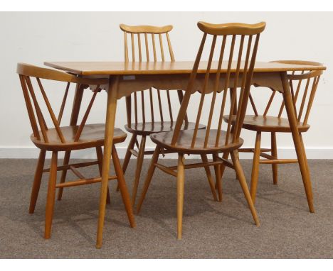 Pair Ercol elm and beech stick back 'Windsor' dining chairs, pair ercol style armchairs, and an oak table with shaped apron o