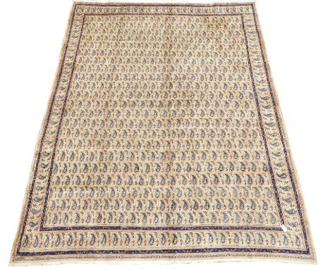 Large Persian Mood beige ground carpet, decorated with repeating Boteh motifs, 380cm x 300cm  Condition Report &amp; Further 