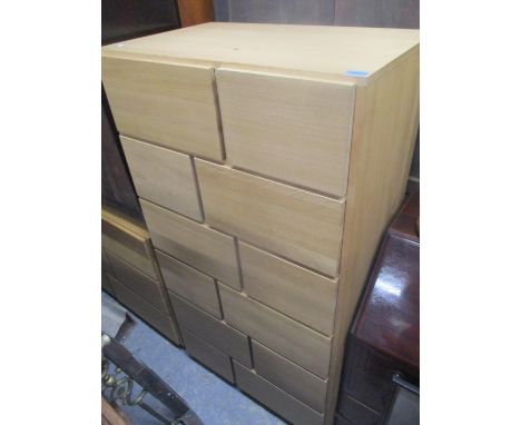 A modern light oak chest of drawers, 58" h x 31" w, together with a matching sideboard, 30" h x 53"w 