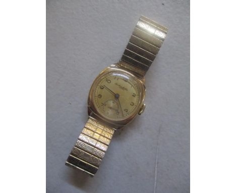 A 9ct gold gents manual wind wristwatch, the dial inscribed Tho Russells Son 