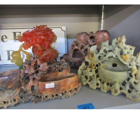 Three oriental soap stone figures and a jade style dragon 