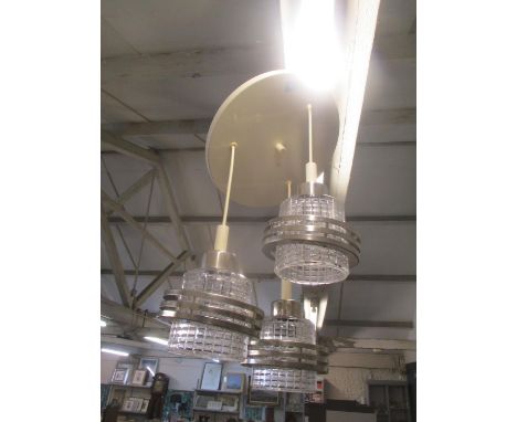 A 1970s ceiling light having three glass and chrome shades, reputedly Polish 