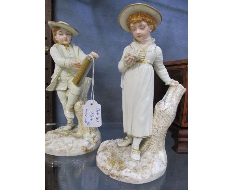 A pair of late 19th century Royal Worcester figures, one of a boy with a sketch pad balanced on his knee, 8 1/4"h and the oth