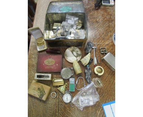 A mixed lot of lighters, coins, Sekonda pocket watch and other items, all in a vintage tin 