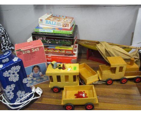 An early 20th century wooden pony yacht on stand, miniature Dr Who Dalek toys and others, together with a blue and white lamp